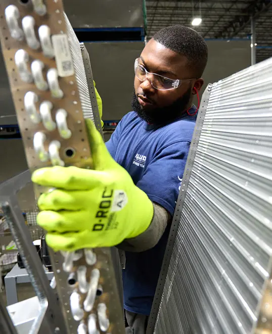 An Allied Air manufacturing team member is working.